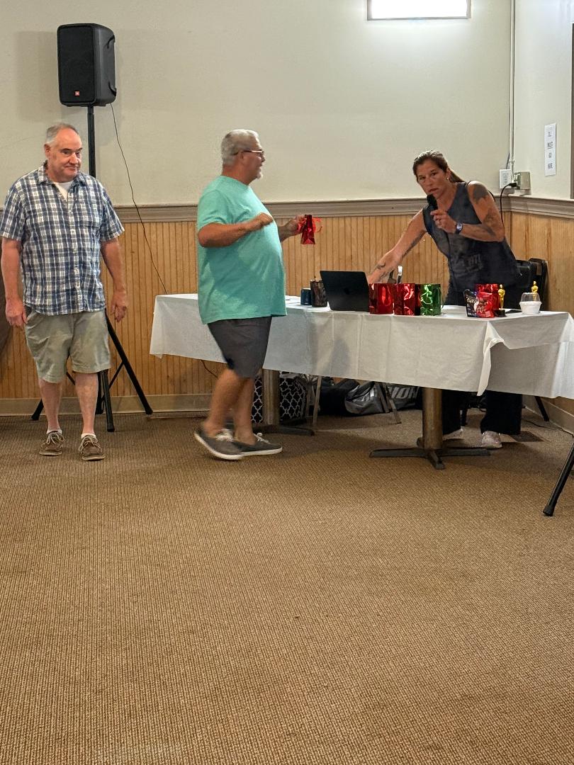 Ed and Tank handing out prizes at Music Bingo Night, July 2026